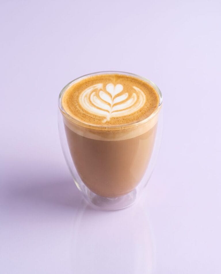 Latte with latte art in a double-walled glass